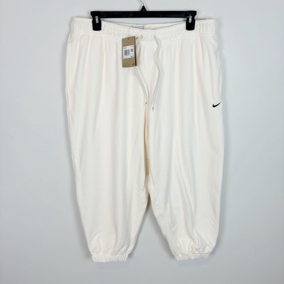 Nike Women's Therma-FIT One Loose Fleece Pants in Pale Ivory Plus Size - Picture 1 of 7